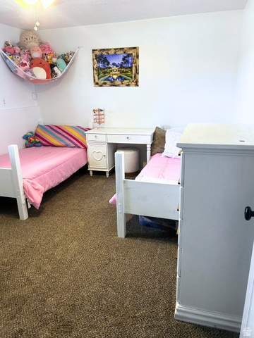 570 250 East Parowan, UT 84761 - Photo 11 of 27 Carpeted room featuring white walls and a ceiling fan