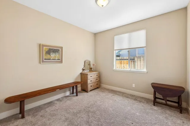 a bedroom with a bed and a lamp