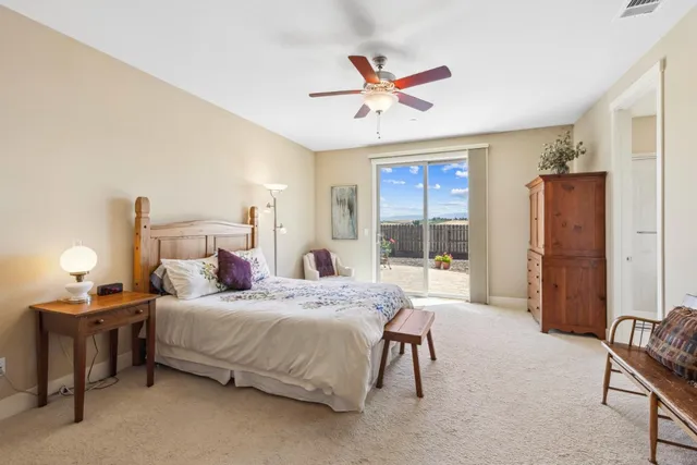 a bathroom with a large tub sink and mirror
