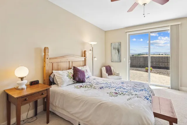 a bedroom with a bed and a desk