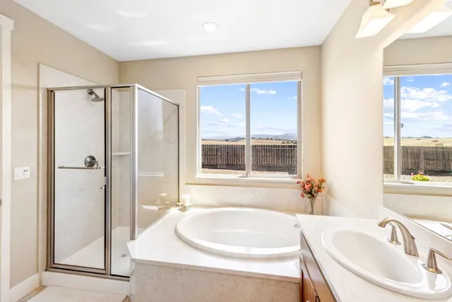 a view of a hallway with bed and furniture