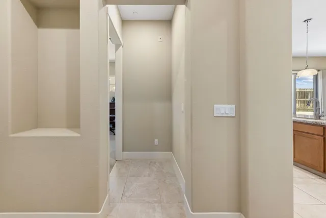 a view of a livingroom with workspace and a window