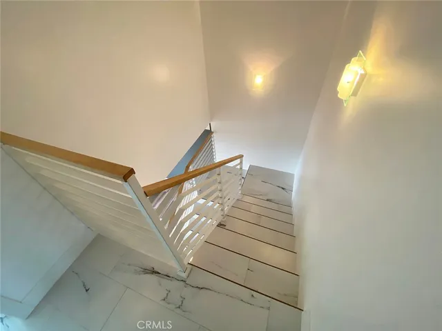 a view of staircase with white walls