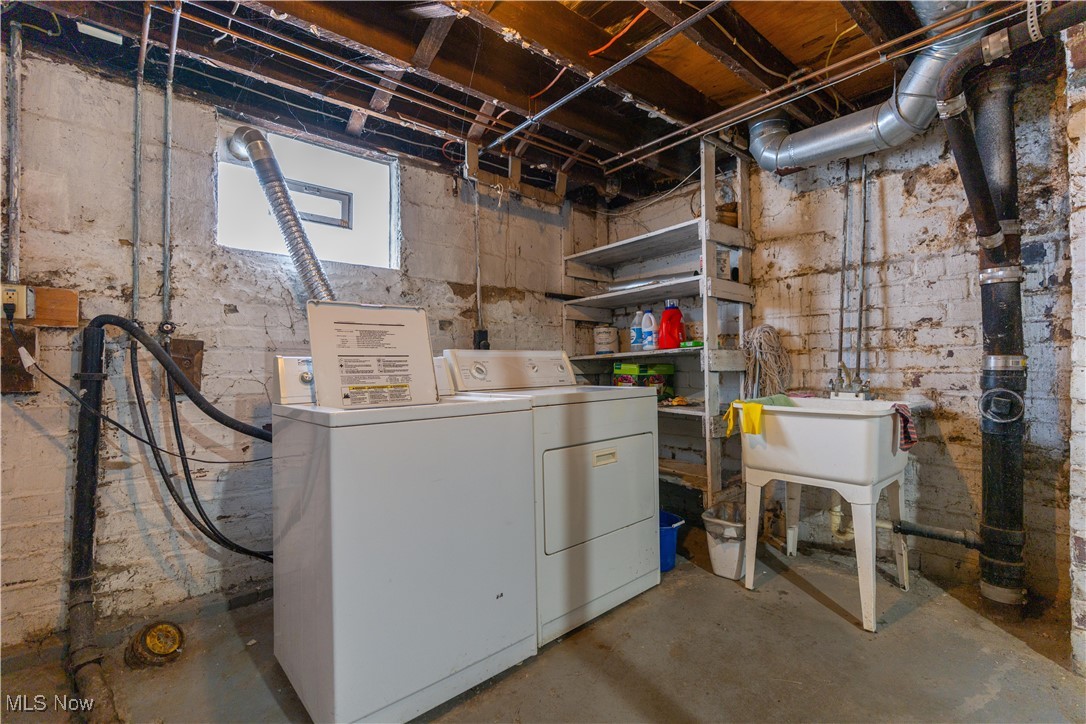 900 4th Street Southwest Canton, OH 44707 - Photo 25 of 31 Below grade area with washer and dryer and a sink