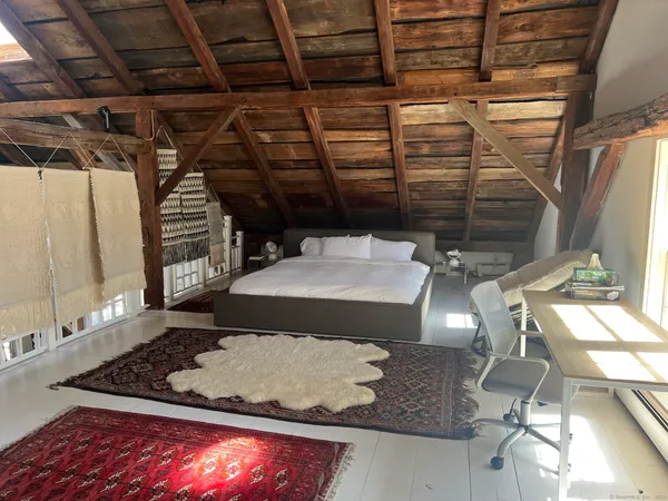 a room with water heater and racks