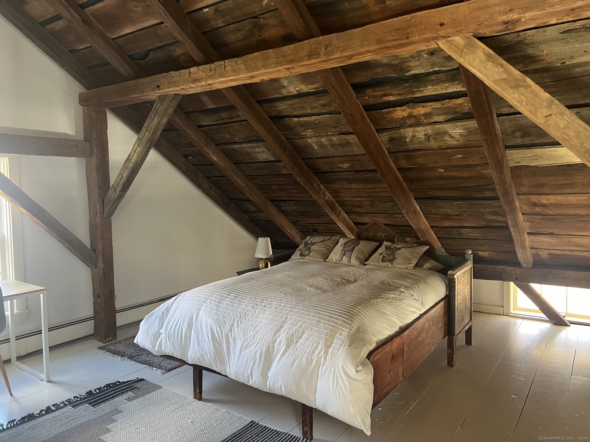 18 Bear Burrow Road Roxbury, CT 06783 - Photo 15 of 17 a bed sitting in a bedroom next to a window