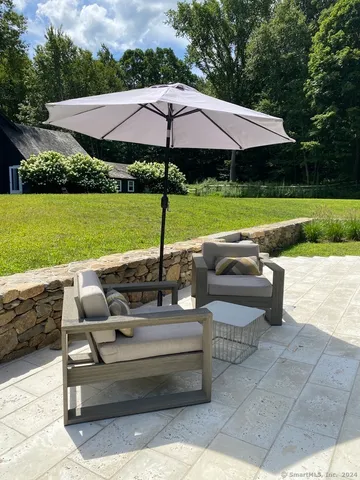 a view of pool with outdoor seating