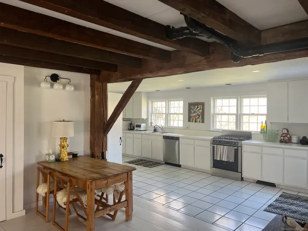 a kitchen with a stove a sink and a refrigerator