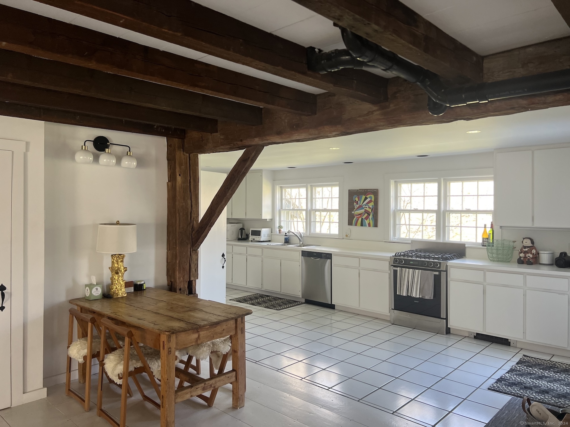 18 Bear Burrow Road Roxbury, CT 06783 - Photo 10 of 17 a kitchen with a stove a sink and a refrigerator