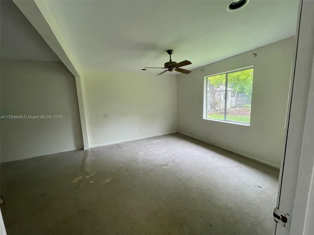 a bathroom with a granite countertop sink a toilet and bathtub