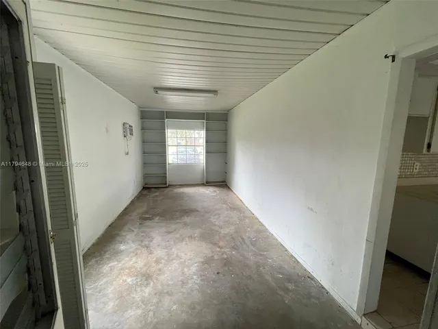 a kitchen with a stove sink and cabinets