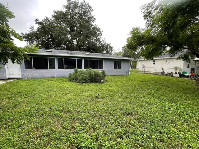 a view of backyard with green space