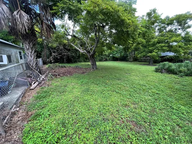 a backyard of a house with lots of green space