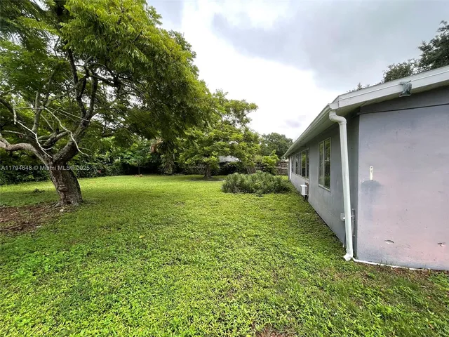 a view of a backyard with a garden