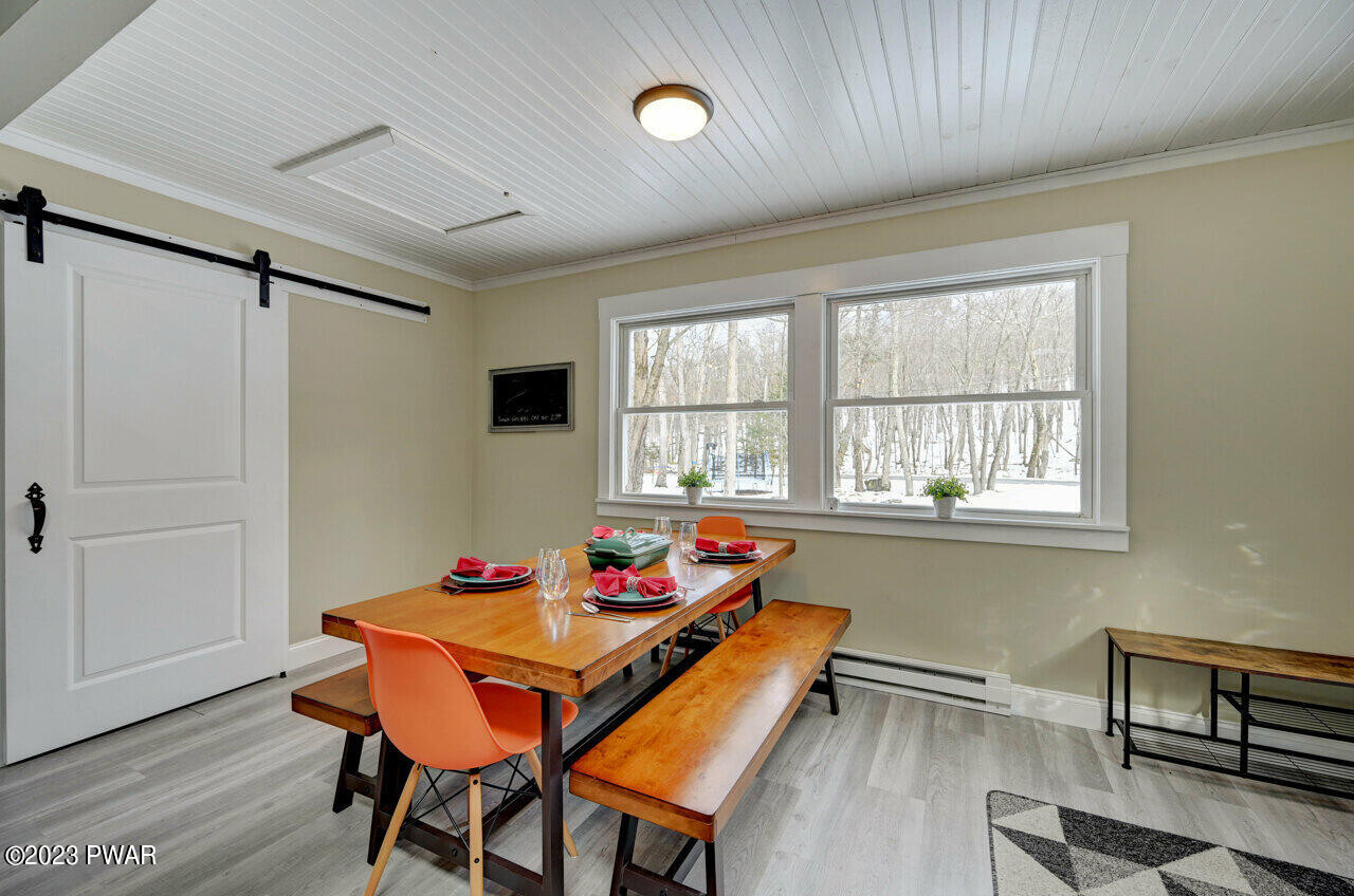 119 Hemlock Road Milford, PA 18337 - Photo 14 of 42 a outdoor dining room with furniture and window