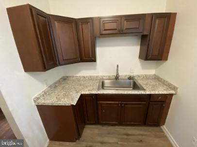 6314 Musgrave Street, Unit 4 Philadelphia, PA 19144 - Photo 3 of 10 a kitchen with stainless steel appliances granite countertop a sink stove and refrigerator