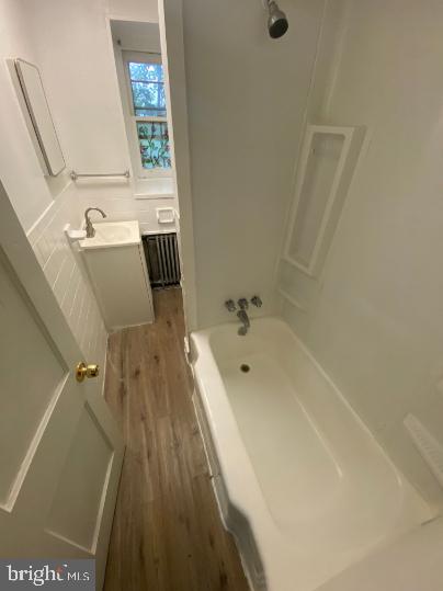 6314 Musgrave Street, Unit 4 Philadelphia, PA 19144 - Photo 10 of 10 a bath tub sitting next to a bathroom sink