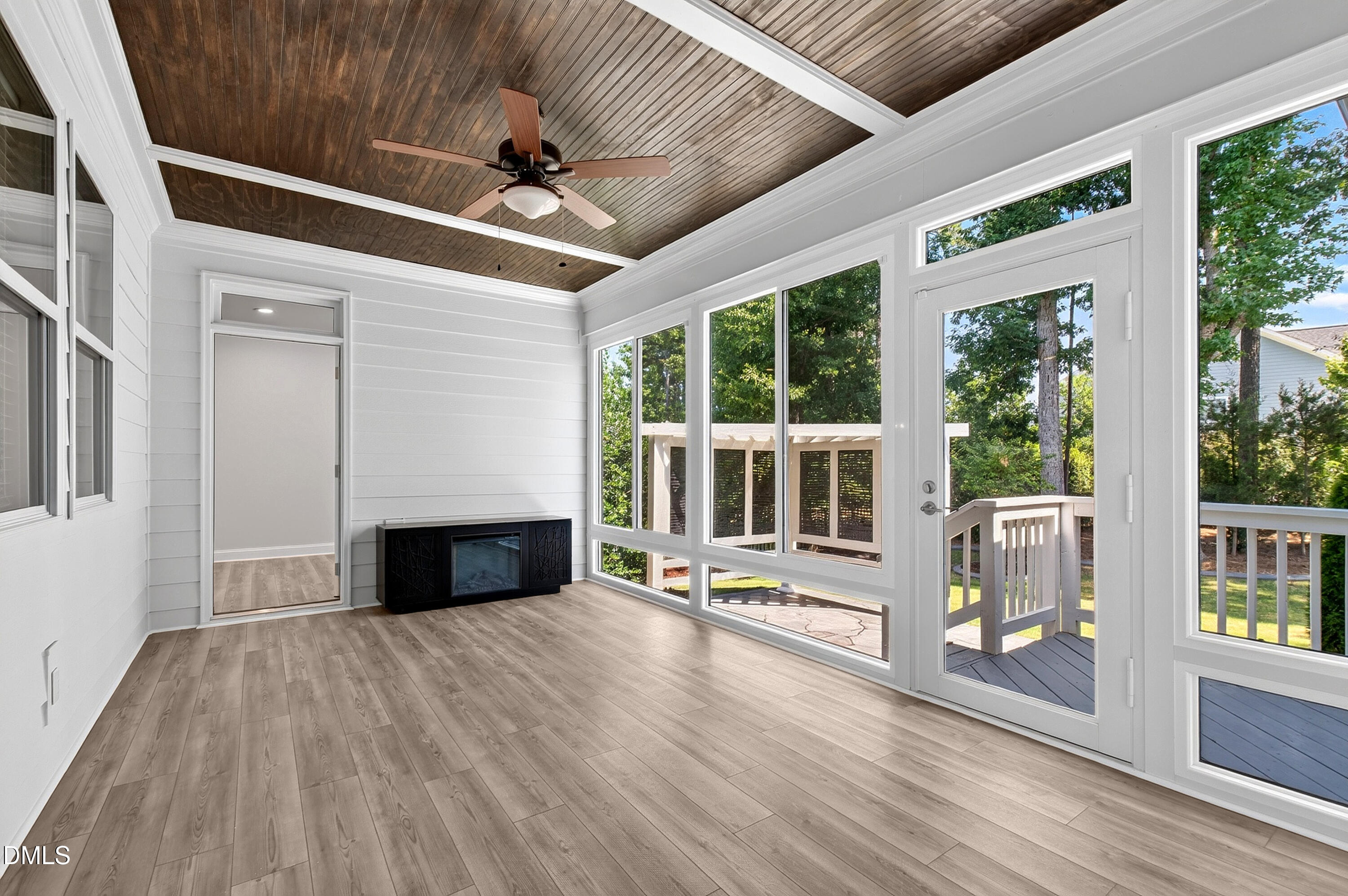 1300 Commons Ford Place Apex, NC 27539 - Photo 26 of 70 a view of an empty room with wooden floor and a window