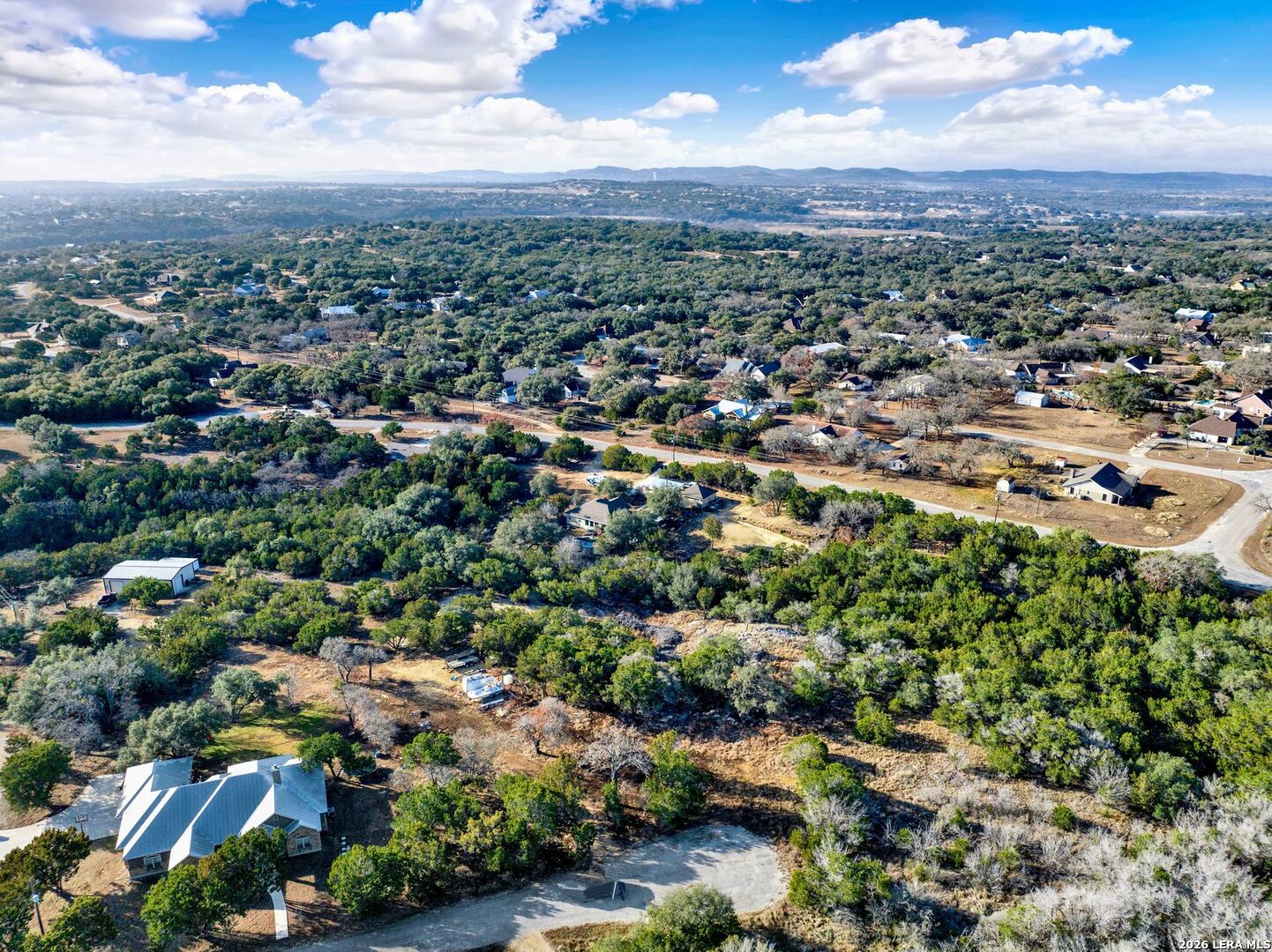 145 Elm Drive Bandera, TX 78003 - Photo 11 of 13 an aerial view of residential houses with outdoor space and trees