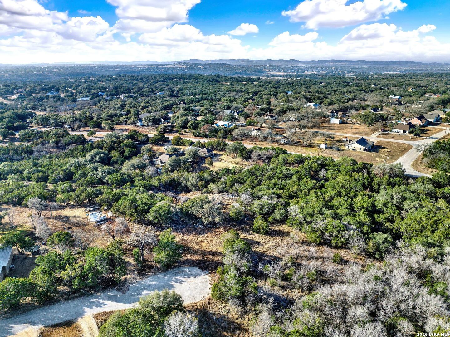 145 Elm Drive Bandera, TX 78003 - Photo 4 of 13 an aerial view of residential houses with outdoor space and trees