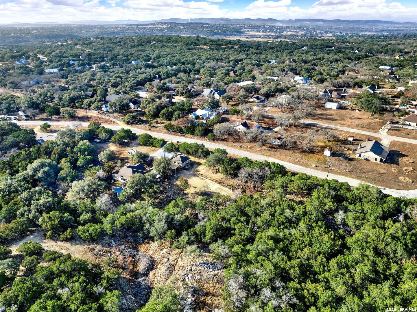 145 Elm Drive Bandera, TX 78003 - Photo 6 of 13 an aerial view of residential houses with outdoor space and trees