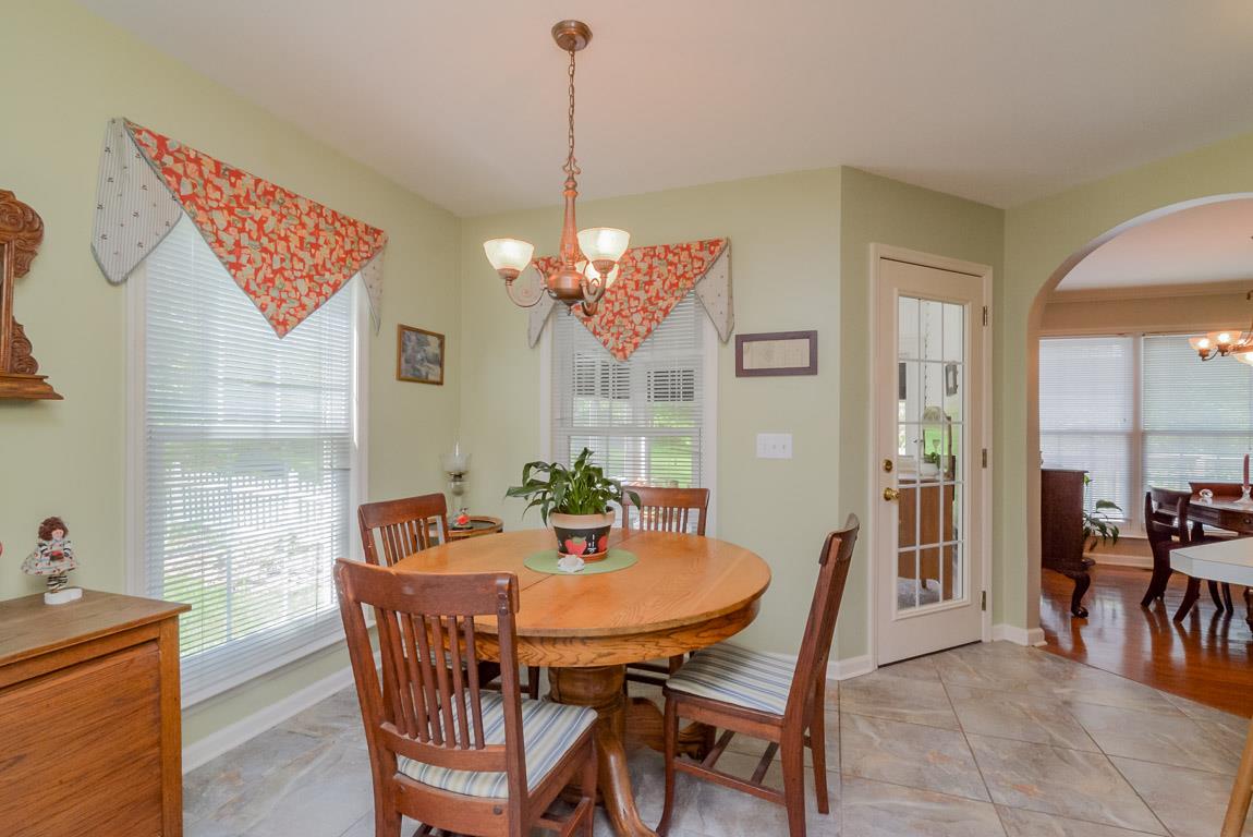 3387 Mahlon Moore Road Spring Hill, TN 37174 - Photo 11 of 29 a dining room with furniture and window