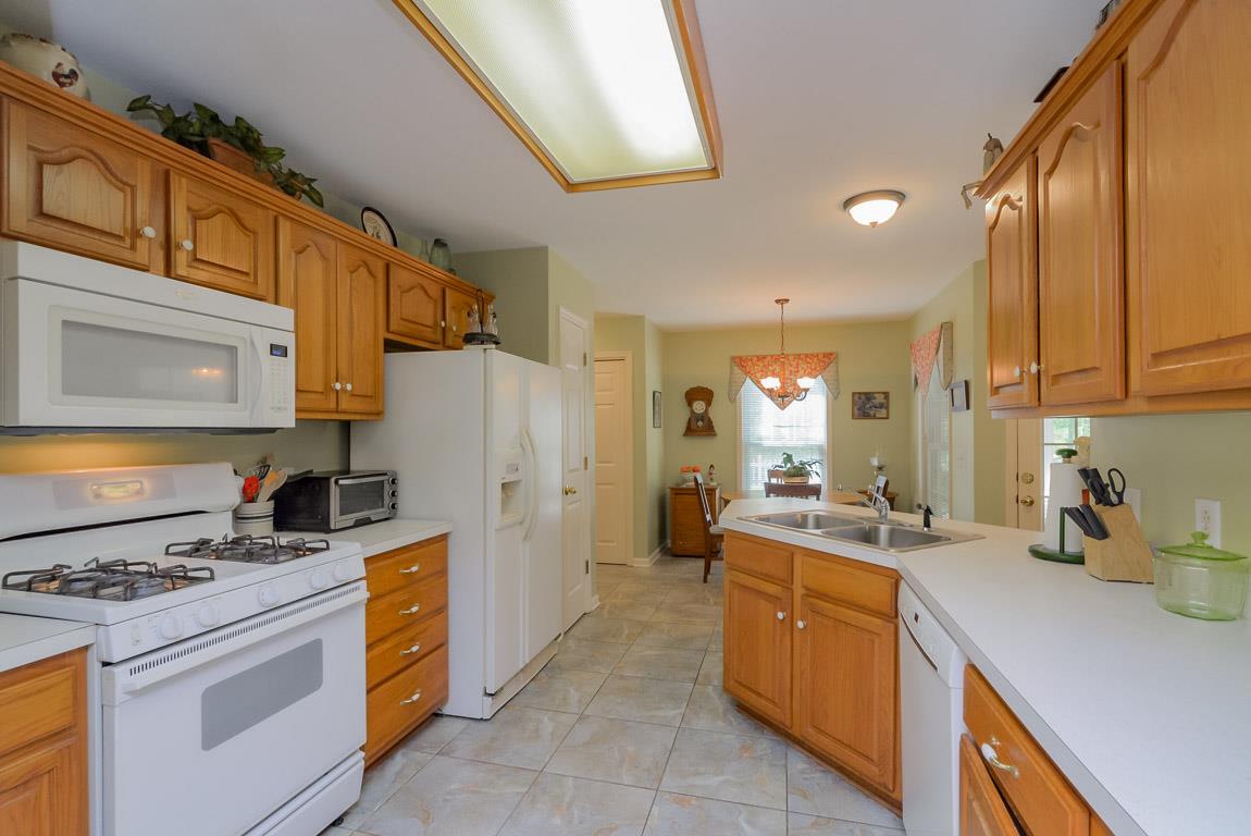 3387 Mahlon Moore Road Spring Hill, TN 37174 - Photo 14 of 29 a kitchen with a sink cabinets and appliances