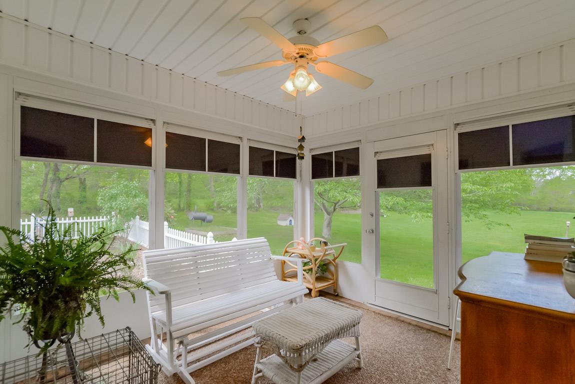 3387 Mahlon Moore Road Spring Hill, TN 37174 - Photo 26 of 29 a living room with patio furniture and garden view