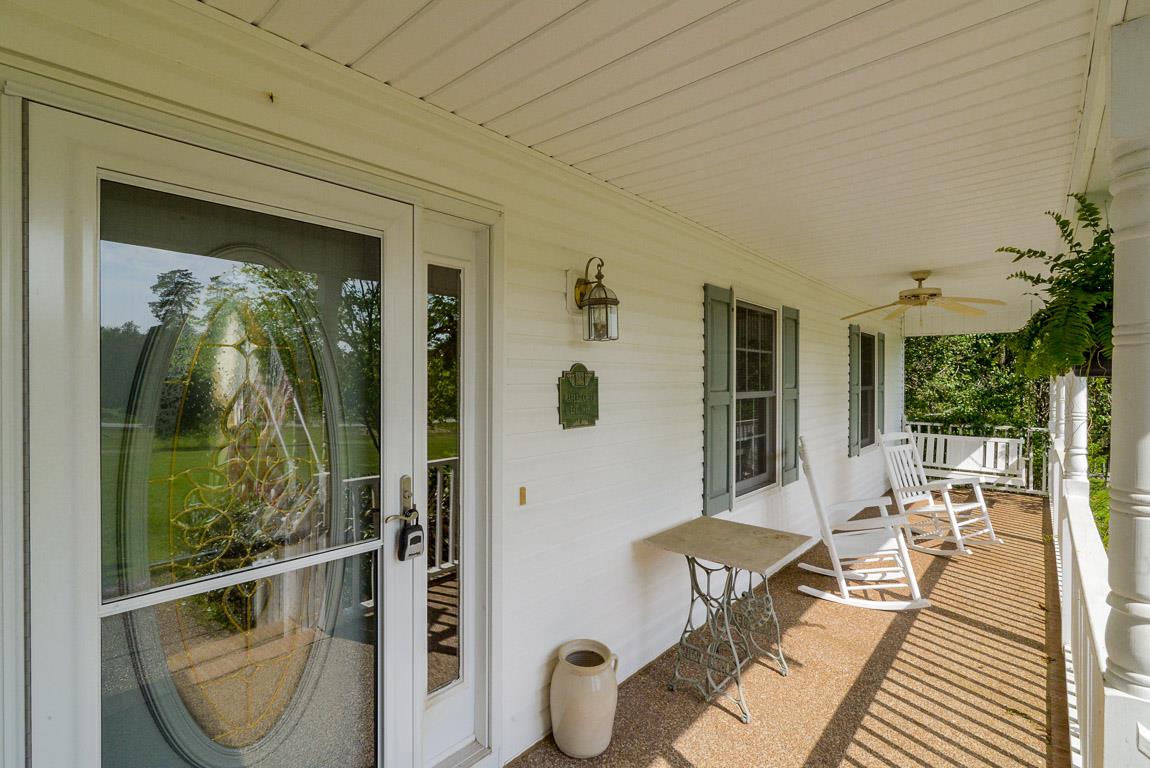 3387 Mahlon Moore Road Spring Hill, TN 37174 - Photo 3 of 29 a front view of a house with outdoor seating