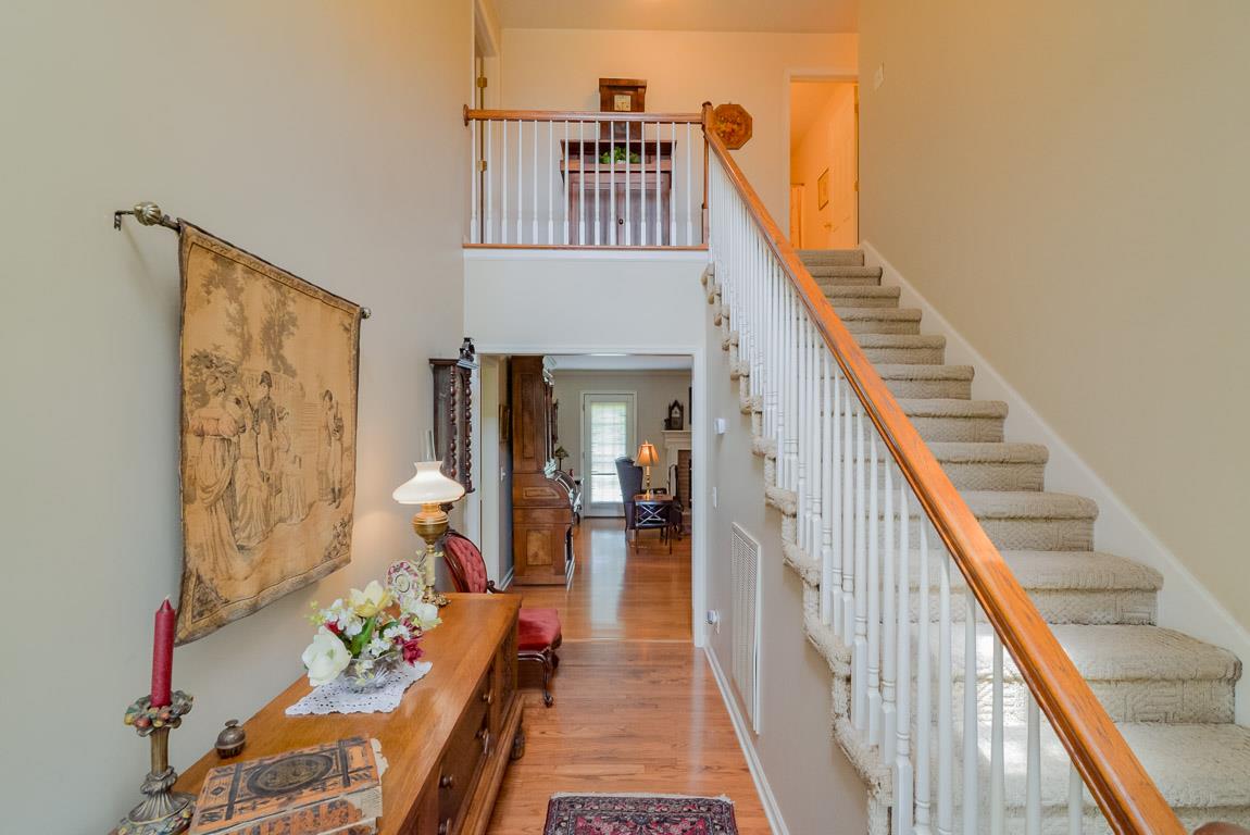 3387 Mahlon Moore Road Spring Hill, TN 37174 - Photo 4 of 29 a view of a hallway with furniture and wooden floor