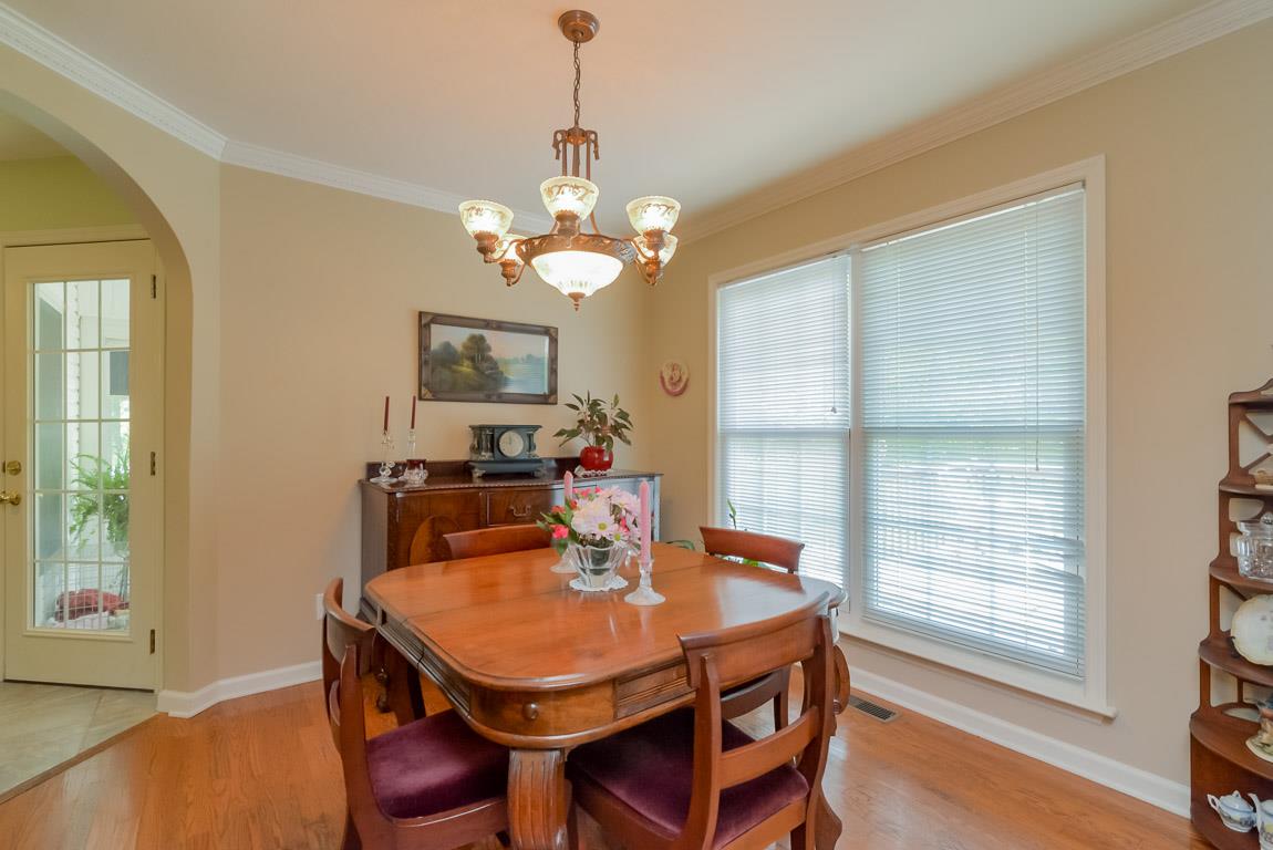 3387 Mahlon Moore Road Spring Hill, TN 37174 - Photo 8 of 29 a view of a dining room with furniture window and wooden floor
