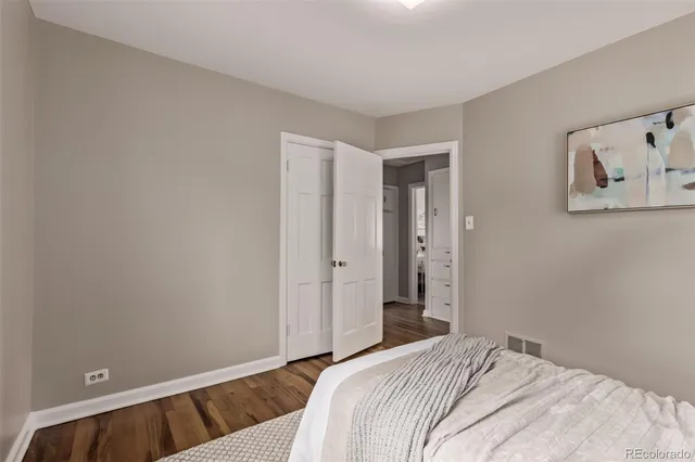 a bedroom with a bed and hallway