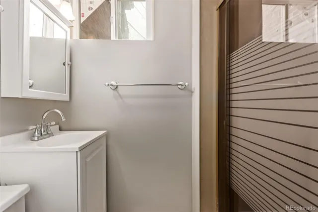 a bathroom with a sink and mirror
