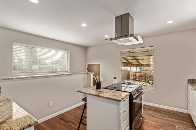 a view of a kitchen with a sink and a window