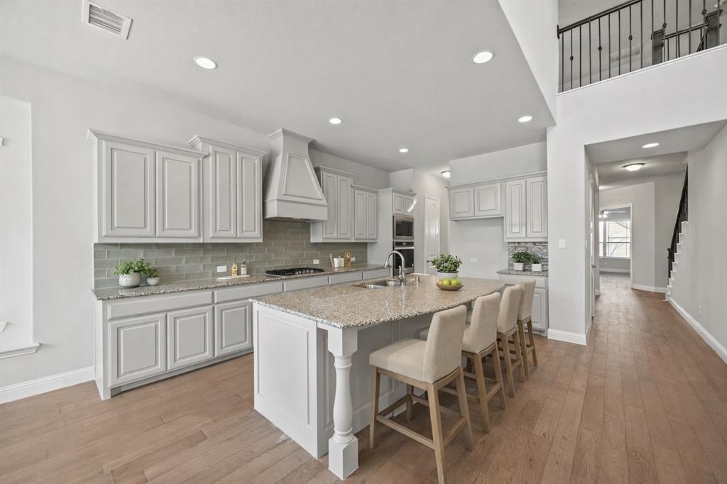 8402 Watersway Drive Rowlett, TX 75088 - Photo 4 of 20 Island Kitchen - virtually staged