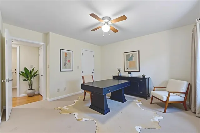 a view of a workspace with furniture