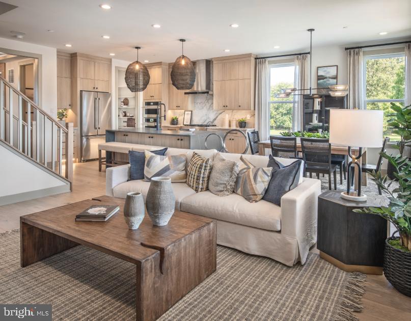 Wildflower Way Royersford, PA 19468 - Photo 3 of 6 a living room with kitchen island furniture and a wooden floor