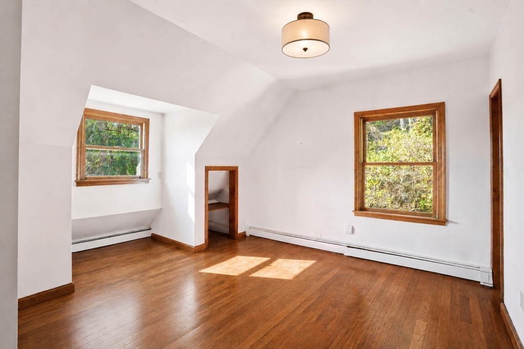 67 Wituwamat Road Weymouth, MA 02191 - Photo 24 of 42 an empty room with wooden floor and windows