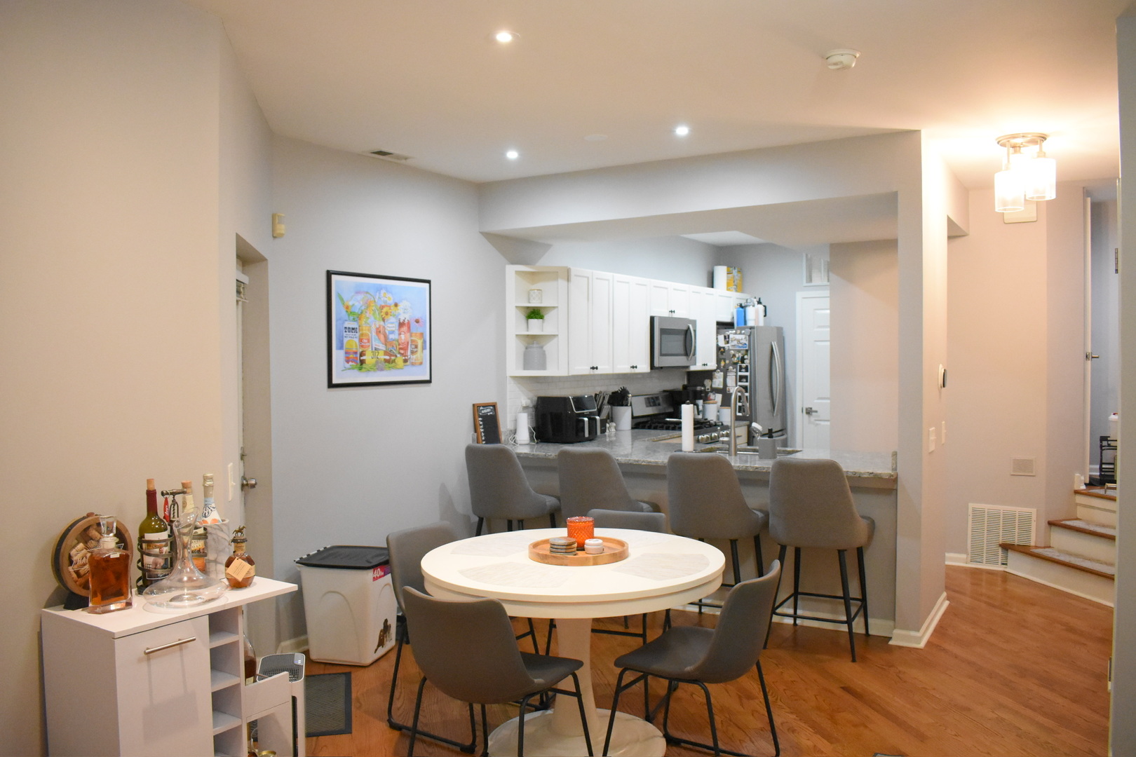 2851 North Southport Avenue, Unit A Chicago, IL 60657 - Photo 7 of 12 a view of a dining room with furniture and wooden floor