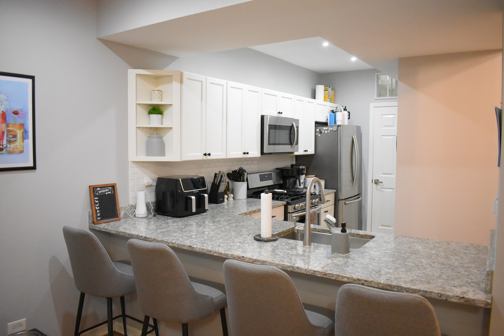 2851 North Southport Avenue, Unit A Chicago, IL 60657 - Photo 8 of 12 a kitchen with refrigerator and sink