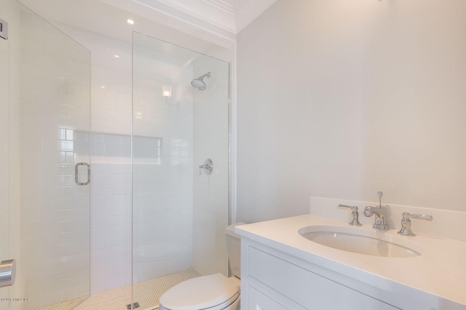 111 Mason Street, Unit 2A Greenwich, CT 06830 - Photo 13 of 18 a bathroom with a sink toilet and shower