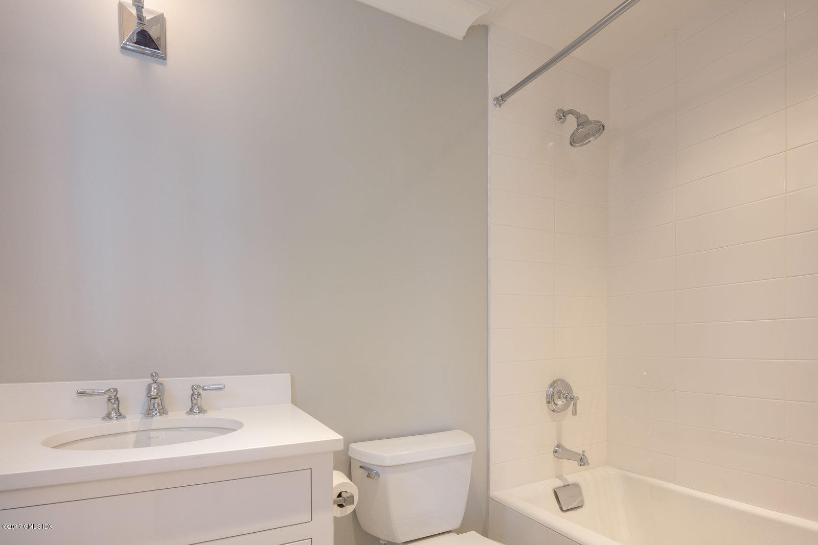 111 Mason Street, Unit 2A Greenwich, CT 06830 - Photo 15 of 18 a bathroom with a sink toilet and vanity