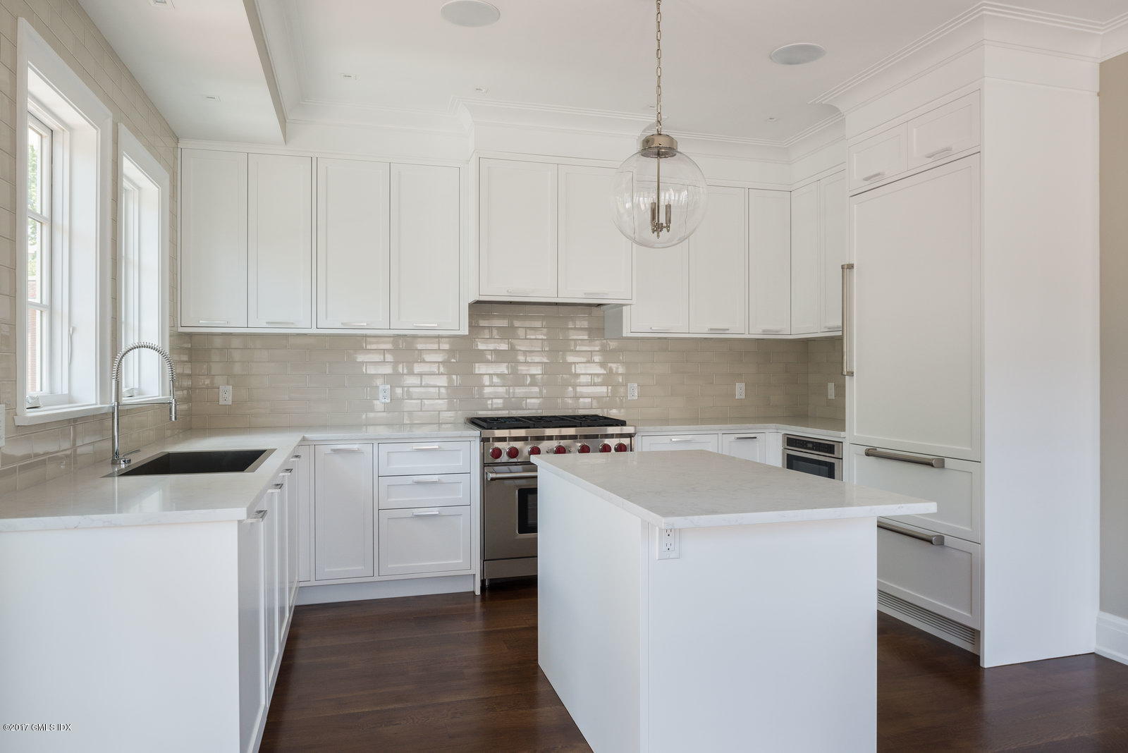 111 Mason Street, Unit 2A Greenwich, CT 06830 - Photo 3 of 18 a kitchen with stainless steel appliances granite countertop a sink stove and refrigerator