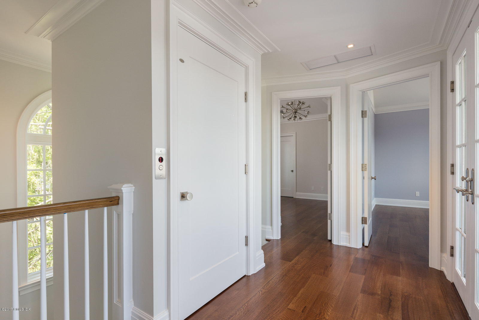 111 Mason Street, Unit 2A Greenwich, CT 06830 - Photo 8 of 18 a view of a hallway with wooden floor