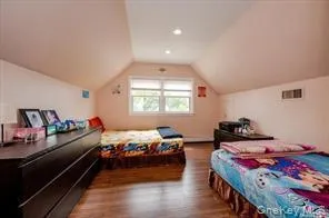 a bed room with bed and window