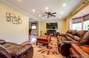 252-14 82nd Road Queens, NY 11426 - Photo 3 of 14 a living room with furniture and a flat screen tv