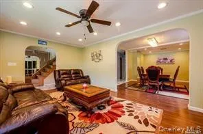 a living room with furniture a rug and a chandelier