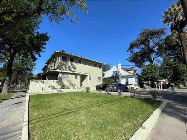 a view of a house with a yard porch and sitting area