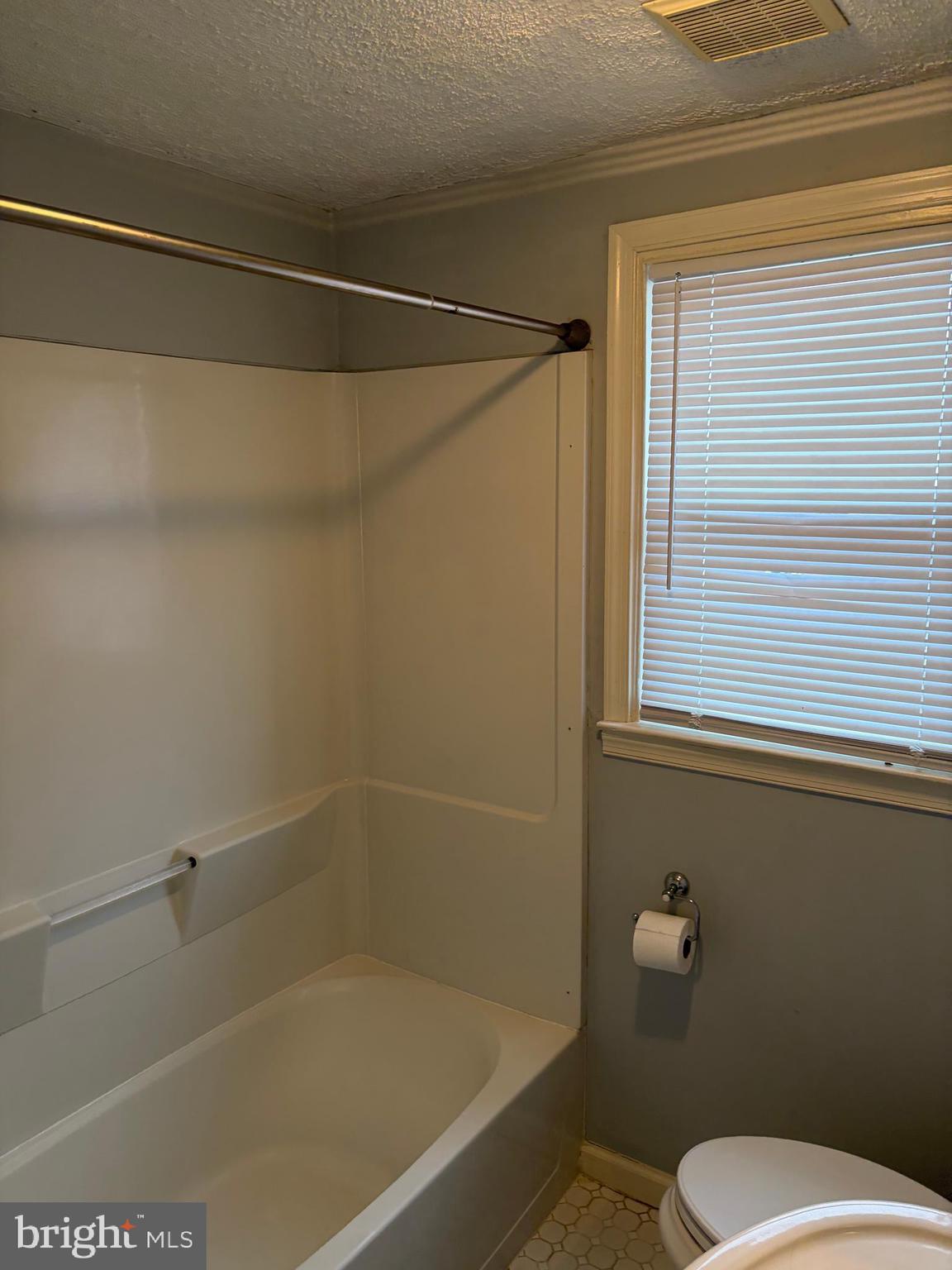 121 Rockglen Road Wynnewood, PA 19096 - Photo 12 of 13 a white toilet sitting next to a window