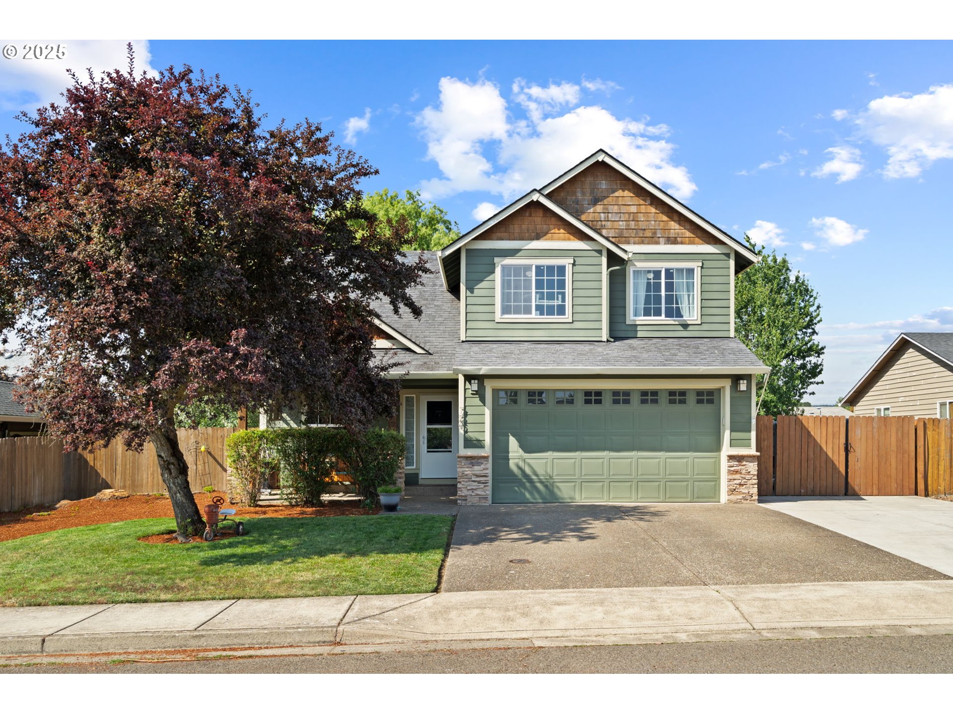 720 East Azalea Street Yamhill, OR 97148 - Photo 1 of 48 a front view of a house with a yard and garage